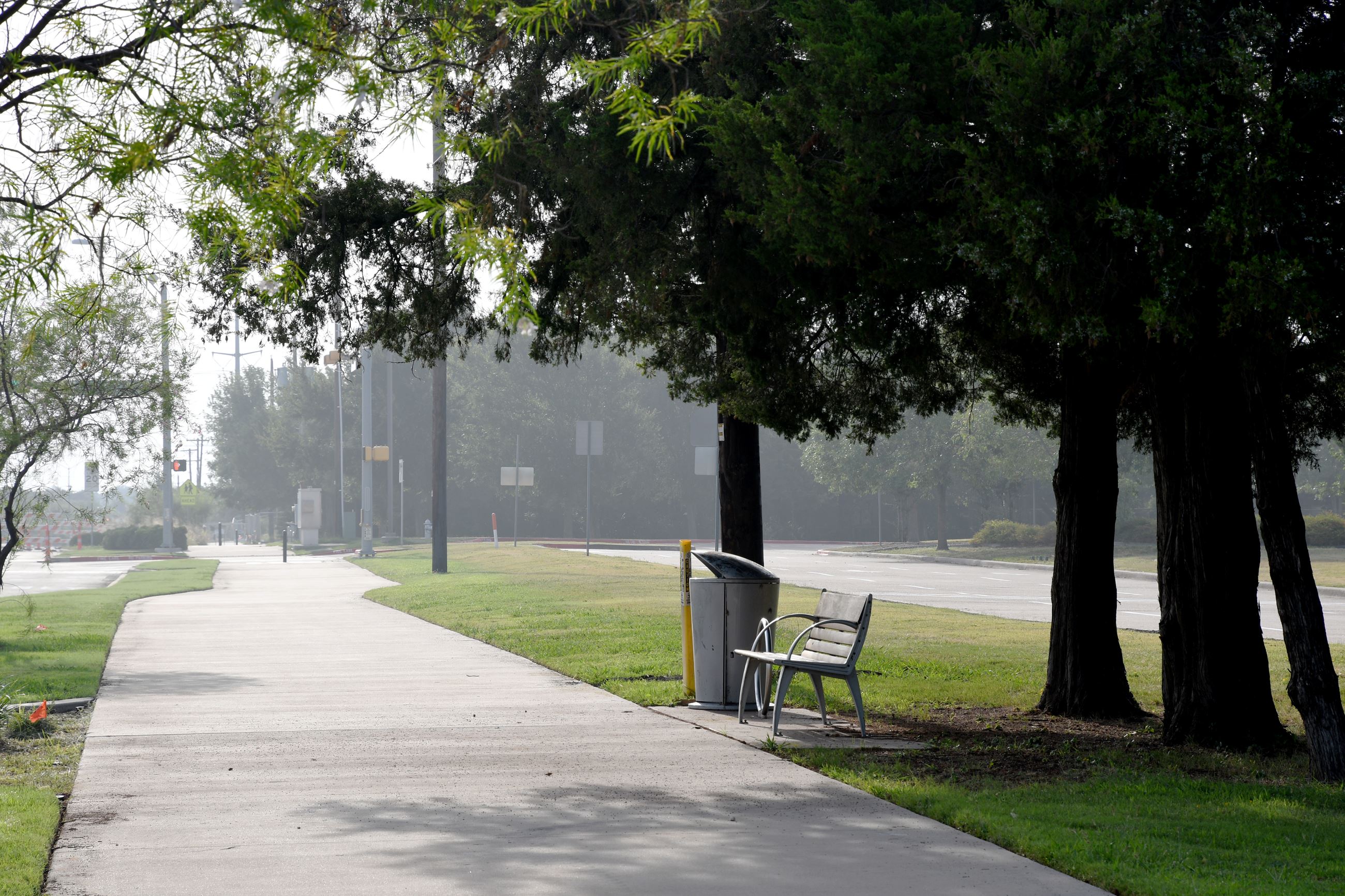 Bench and trash can on Pleasant Run Trail