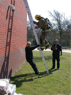 Firefighter Climbing Ladder